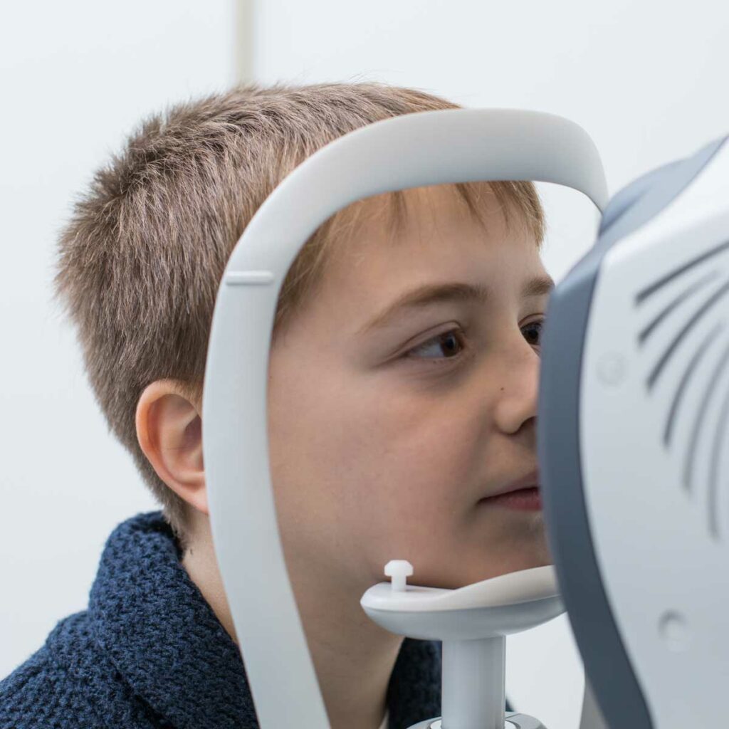 young boy having his eyes tested
